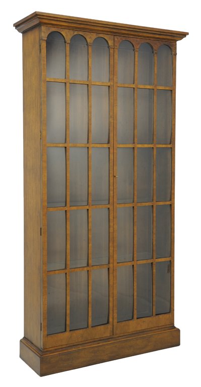 A LATE GOTHIC STYLE GLAZED CURIO BOOKCASE CABINET: A LATE GOTHIC STYLE GLAZED CURIO BOOKCASE CABINET Late 20th Century A tall Restauration style bookcase features a stepped cornice and two glazed doors with repeating arches, having wood supports and a