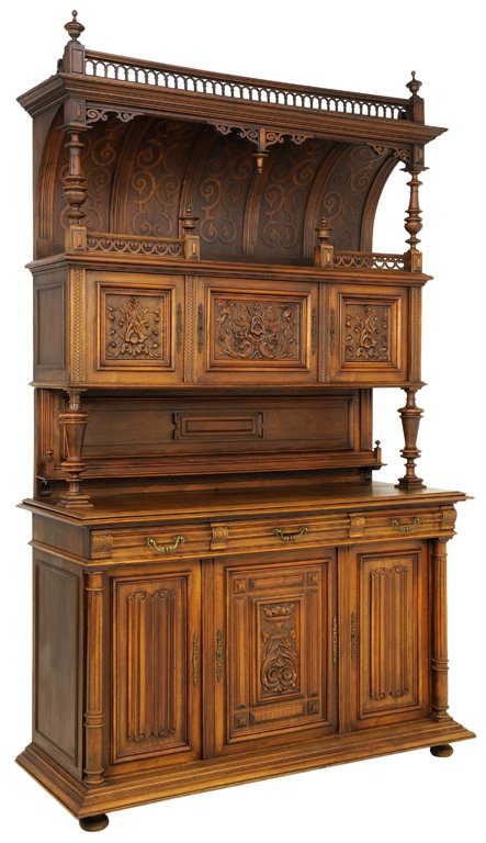 A FRENCH VICTORIAN STYLE BARREL VAULT CANOPIED BUFFET: A FRENCH VICTORIAN STYLE BARREL VAULT CANOPIED BUFFET Early 20th Century A French Victorian style buffet features a piereced arcade cornice with flanking sheraton finials, having an inverted stepped e