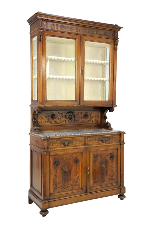 A HENRI II STYLE WALNUT BUFFET BOOKCASE WITH LACE AND: A HENRI II STYLE WALNUT BUFFET BOOKCASE WITH LACE AND MARBLE TOP Early 20th Century A Henri II style walnut finish buffet bookcase features a stepped cornice with carved floret roundel frieze, having 
