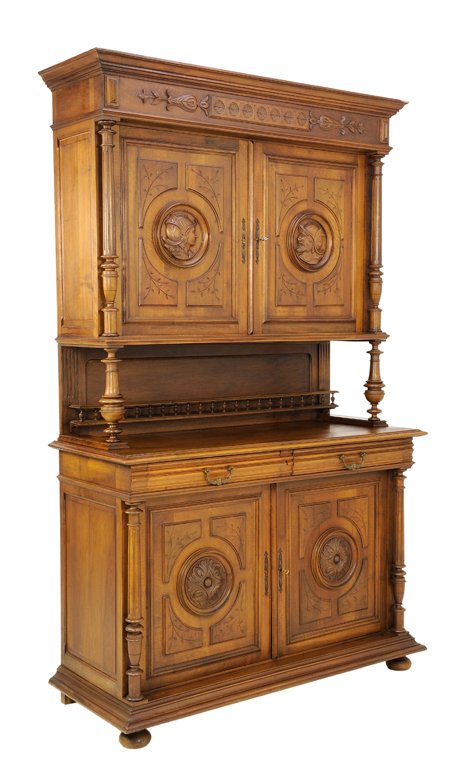 A NEOCLASSICAL REVIVAL STYLE BUFFET IN A WALNUT FINISH: A NEOCLASSICAL REVIVAL STYLE BUFFET IN A WALNUT FINISH WITH CARVED ROMAN SOLDIERS Mid 20th Century A Neoclassical style buffet in a walnut finish is crowned by a carved floret and acanthus frieze, abo