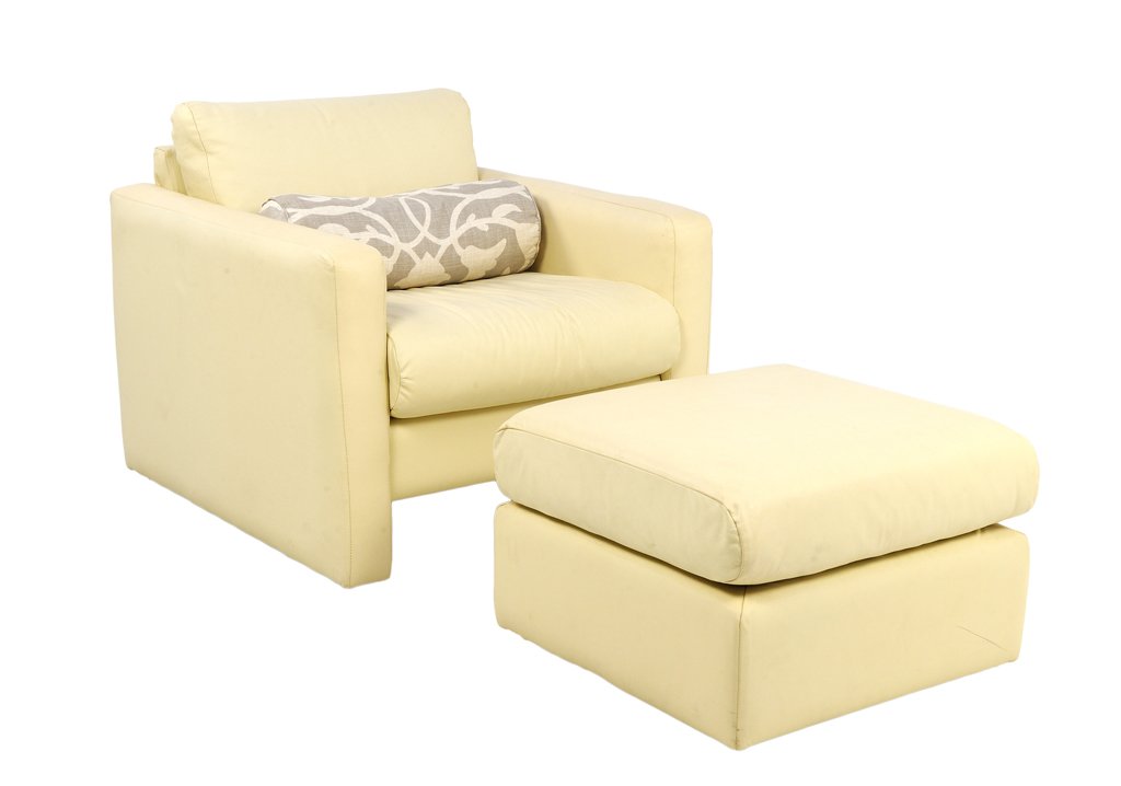 A WHITE LEATHER MID-CENTURY MODERN CLUB CHAIR WITH: A WHITE LEATHER MID-CENTURY MODERN CLUB CHAIR WITH OTTOMAN Mid-Late 20th Century A vintage modern design white leather club chair with matching ottoman includes a lumbar design pillow. Minor wear dete