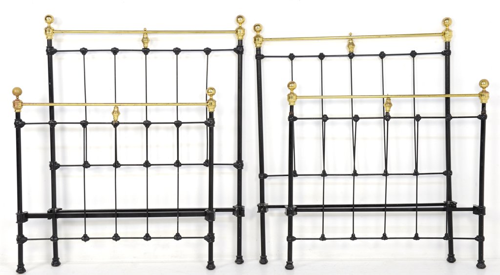 A PAIR OF BRASS FINISH AND BLACK PAINTED TWIN BEDS: A PAIR OF BRASS FINISH AND BLACK PAINTED TWIN BEDS 20th Century Each brass finish bed featuring a straight crest rail flanked by finials surmounting a painted black head and footboard. Fair to Good co