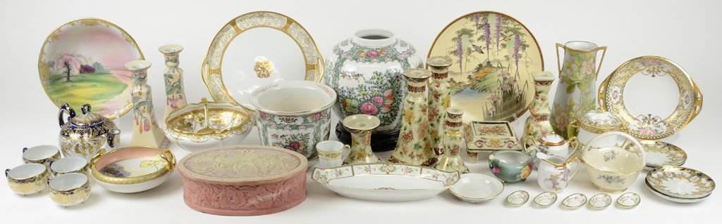 A COLLECTION OF VINTAGE GILT AND PAINTED JAPANESE: A COLLECTION OF VINTAGE GILT AND PAINTED JAPANESE NIPPON CHINA Including over 30 pieces. Carved box included. 4½ x 17¾ x 13 inches