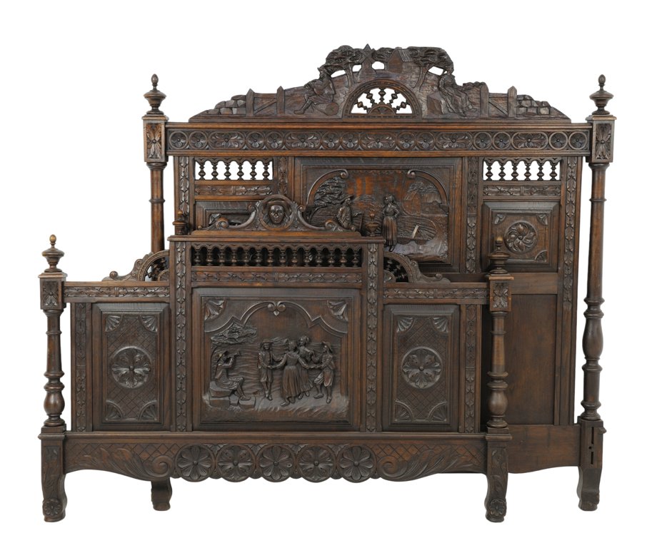 A FRENCH BRITTANY STYLE BED WITH DANCING AND PASTORAL: A FRENCH BRITTANY STYLE BED WITH DANCING AND PASTORAL SCENES Late 19th-Early 20th Century A bed carved with dancing, musical and pastoral figures features finial galleries, Sheraton style finials, and