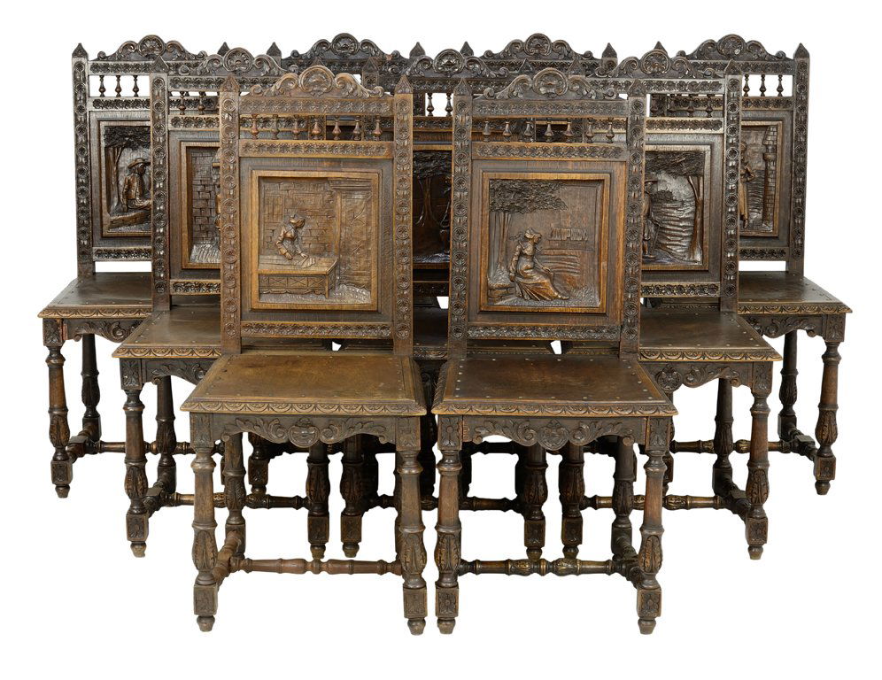 A COLLECTION OF NINE FRENCH BRITTANY STYLE OAK CHAIRS: A COLLECTION OF NINE FRENCH BRITTANY STYLE OAK CHAIRS WITH CARVED NARRATIVE MEDALLION BACKS Early 20th Century Nine pieces total. Wear commensurate with age. 41 x 18 x 17¾ inches