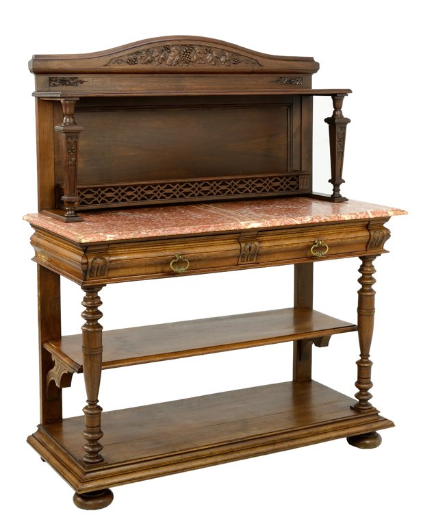 A HENRI II STYLE SIDEBOARD WITH RED MARBLE TOP: A HENRI II STYLE SIDEBOARD WITH RED MARBLE TOP Mid 20th Century A Henri II style red marble topped sideboard with carved vineyard motif crest and supports and a pierced medallion gallery to the backsp