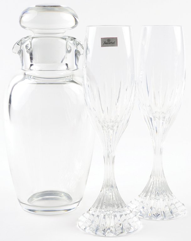 THREE PIECES OF BACCARAT CRYSTAL: THREE PIECES OF BACCARAT CRYSTAL A pair of ""Massena"" toasting flutes in signature gift box, together with a double lip wine carafe. Each marked with the Baccarat logo to the bottom From the Estate o