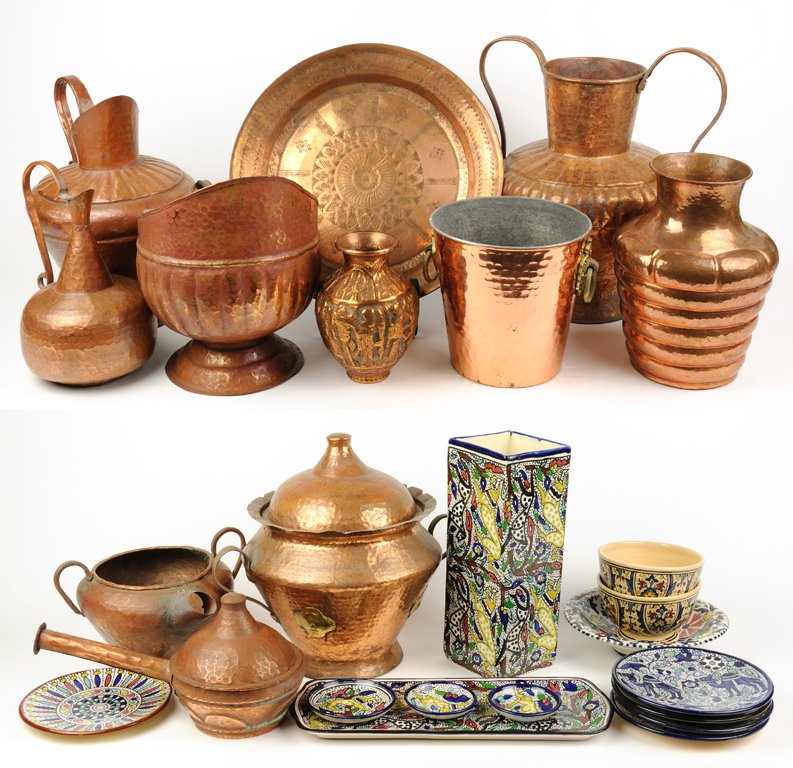 A 24 PIECE TUNISIAN COLLECTION INCLUDING HAMMERED: A 24 PIECE TUNISIAN COLLECTION INCLUDING HAMMERED COPPER AND POTTERY PIECES 20th Century A collection of 24 Tunisian pieces, including hand-hammered copper vessels, a charger, and colorfully enamled p