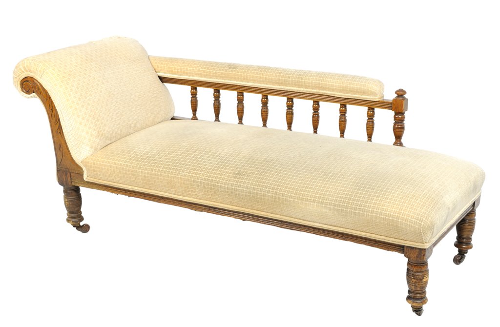 AN ANTIQUE LATE VICTORIAN TURNED STYLE CHAISE LOUNGE: AN ANTIQUE LATE VICTORIAN TURNED STYLE CHAISE LOUNGE From the Estate of Maxine and Emil Mesinger Late 19th-Early 20th Century Scratching detected to wood. Major wear and damage to upholstery; recover