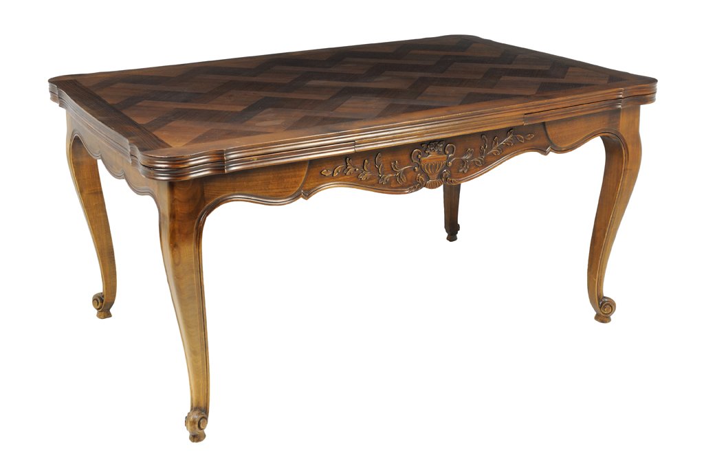 A PROVINCIAL LOUIS XV STYLE WALNUT DRAW LEAF TABLE WITH: A PROVINCIAL LOUIS XV STYLE WALNUT DRAW LEAF TABLE WITH BASKET WEAVE PARQUETRY TOP AND CARVED URN DETAILS Early 20th Century In very good condition, wear minor. 29¾ x 59 x 39 inches