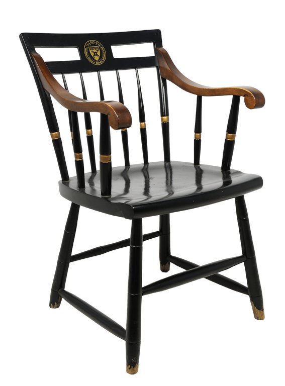 A HARDVARD GRADUATE SCHOOL OF BUSINESS WINDSOR STYLE: A HARDVARD GRADUATE SCHOOL OF BUSINESS WINDSOR STYLE ARMCHAIR WITH BLACK AND GOLD MEDALLION Wear to feet detected, in overall very good condition. 34 x 21½ x 24 inches