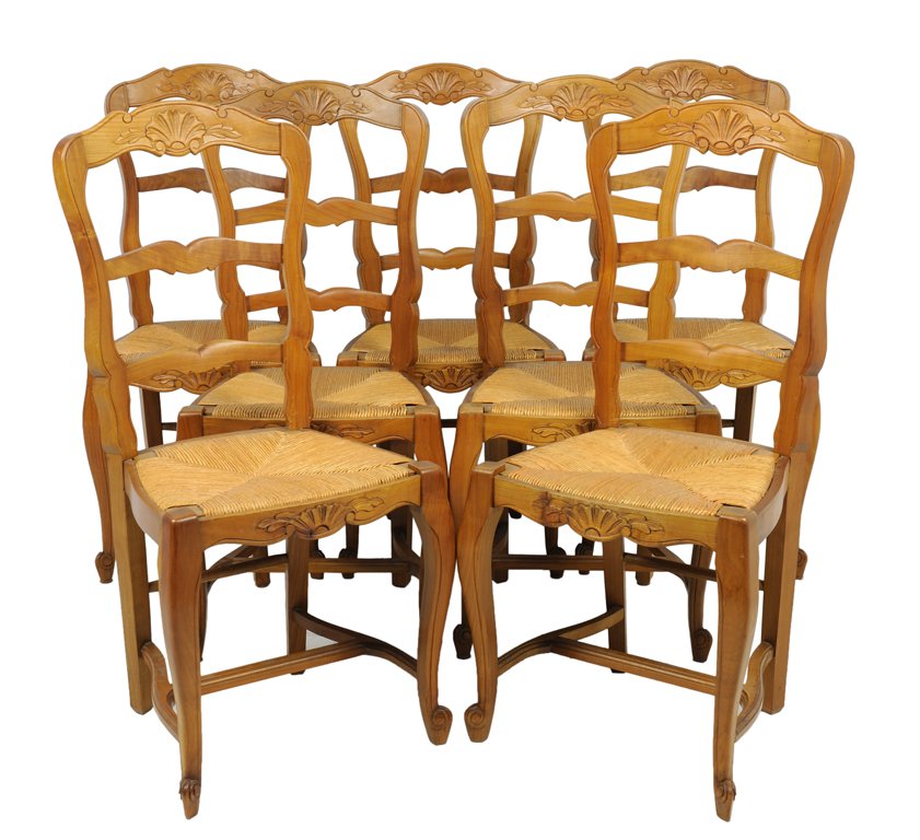 A SET OF SEVEN PROVINCIAL FRENCH STYLE RUSH SEAT CHAIRS: A SET OF SEVEN PROVINCIAL FRENCH STYLE RUSH SEAT CHAIRS Early-Mid 20th Century The set of seven side chairs features a serpentine shaped crest rail, with carved shell detail at center, ladder back con
