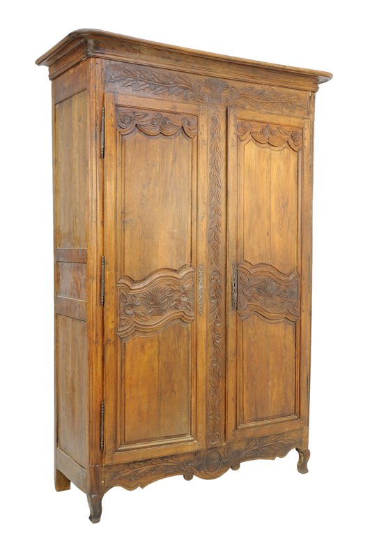 A FRENCH PROVINCIAL STYLE OAK ARMOIRE WITH CARVED WHEAT: A FRENCH PROVINCIAL STYLE OAK ARMOIRE WITH CARVED WHEAT Mid-Late 19th Century The antique armoire with stepped cornice features a foliate carved frieze and center piece, two raised panel doors with ce