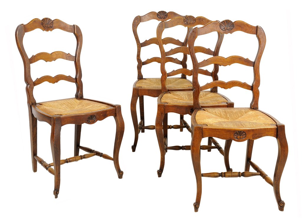 FOUR FRENCH PROVINCIAL STYLE OAK LADDERBACK CHAIRS: FOUR FRENCH PROVINCIAL STYLE OAK LADDERBACK CHAIRS Each having a curved crest rail centered with a shell over the repeating horizontal splats above rush seat, raised on cabriole legs, joined by an H-f