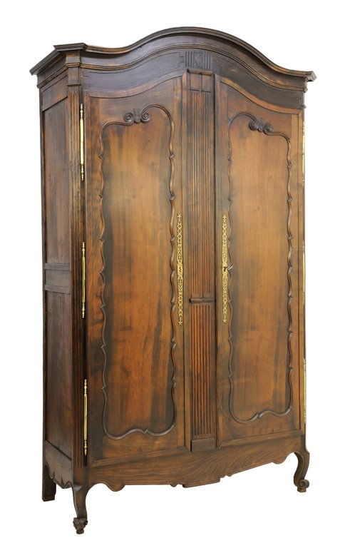 A FRENCH LOUIS XV STYLE KINGWOOD ARMOIRE: A FRENCH LOUIS XV STYLE KINGWOOD ARMOIRE The paneled two door armoire with carved scroll decoration, gilt metal hinges and escutcheons, arched cornice, shaped apron, raised on short cabriole legs. 103
