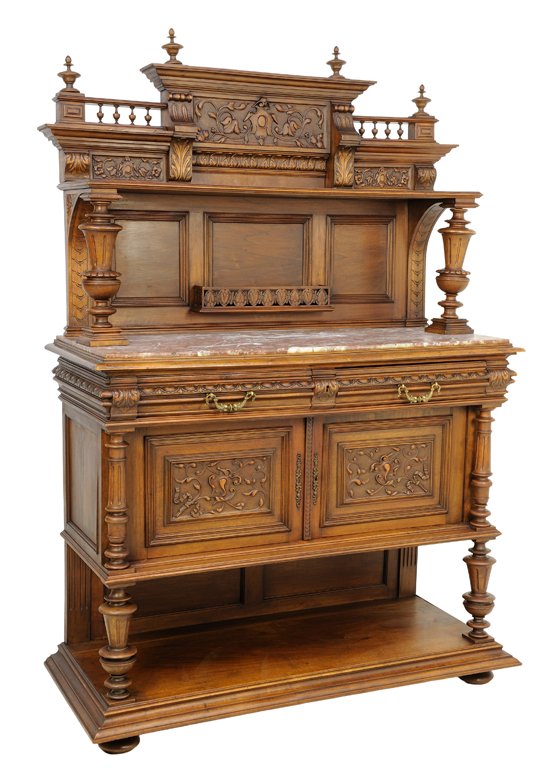 A RENAISSANCE REVIVAL WALNUT SERVER: A RENAISSANCE REVIVAL WALNUT SERVER The server with two drawers and two paneled doors, stepped cornice set with four turned finials above the foliate and anthemion carved frieze, raised on baluster fo