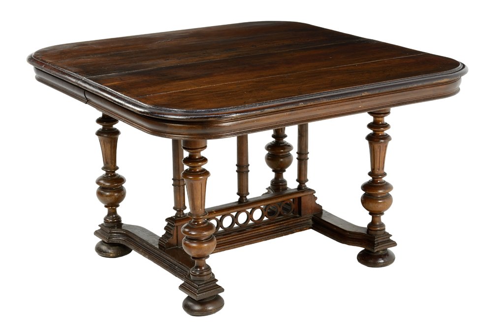 A RENAISSANCE REVIVAL WALNUT DINING TABLE: A RENAISSANCE REVIVAL WALNUT DINING TABLE The rectangular top having rounded corners, raised on a series of turned supports, joined by an H-form stretcher, ending in flattened ball feet. 26¾ x 43½ x
