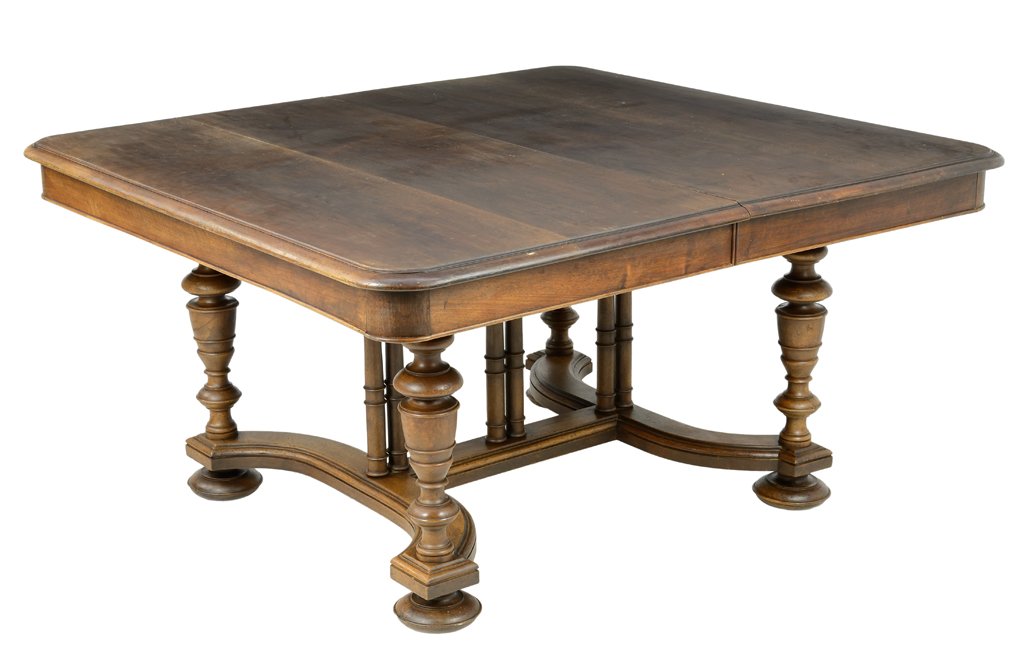 A FRENCH RENAISSANCE REVIVAL WALNUT DINING TABLE: A FRENCH RENAISSANCE REVIVAL WALNUT DINING TABLE The rectangular top with rounded corners over the conforming freize, raised on baluster form legs, joined by an H-form stretcher, ending in squat ball