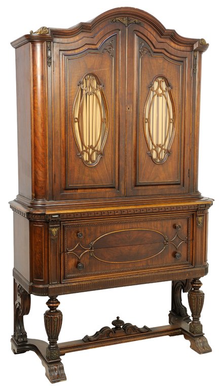 AN AMERICAN VAN BLERKOM FURNITURE CO. MAHOGANY: AN AMERICAN VAN BLERKOM FURNITURE CO. MAHOGANY SECRETARY BOOKCASE The secretary having a stepped and domed cornice over two paneled doors over two long drawers, raised on baluster form fore legs and s