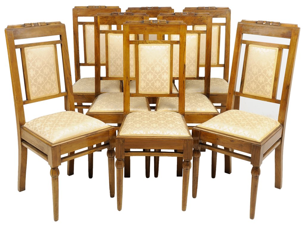 A SET OF EIGHT ART DECO STYLE WALNUT SIDE CHAIRS: A SET OF EIGHT ART DECO STYLE WALNUT SIDE CHAIRS Each chair having a straight crest rail over the upholstered back and seat, raised on tapering legs. 40½ x 16½ x 18 inches.