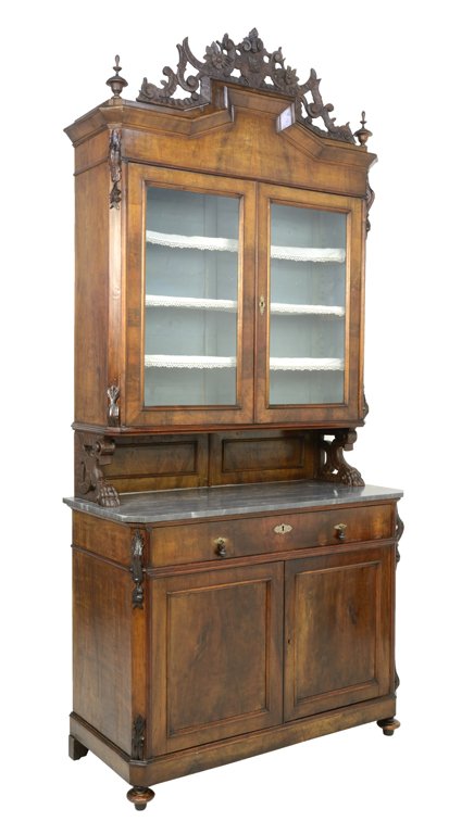 A CONTINENTAL WALNUT GLAZED BUFFET A DEUX CORP: A CONTINENTAL WALNUT GLAZED BUFFET A DEUX CORP The buffet with a pierced flower and foliate crown, flanked by Sheraton style finials with glazed shelving upper cabinet with islet lace fringe edge, pie
