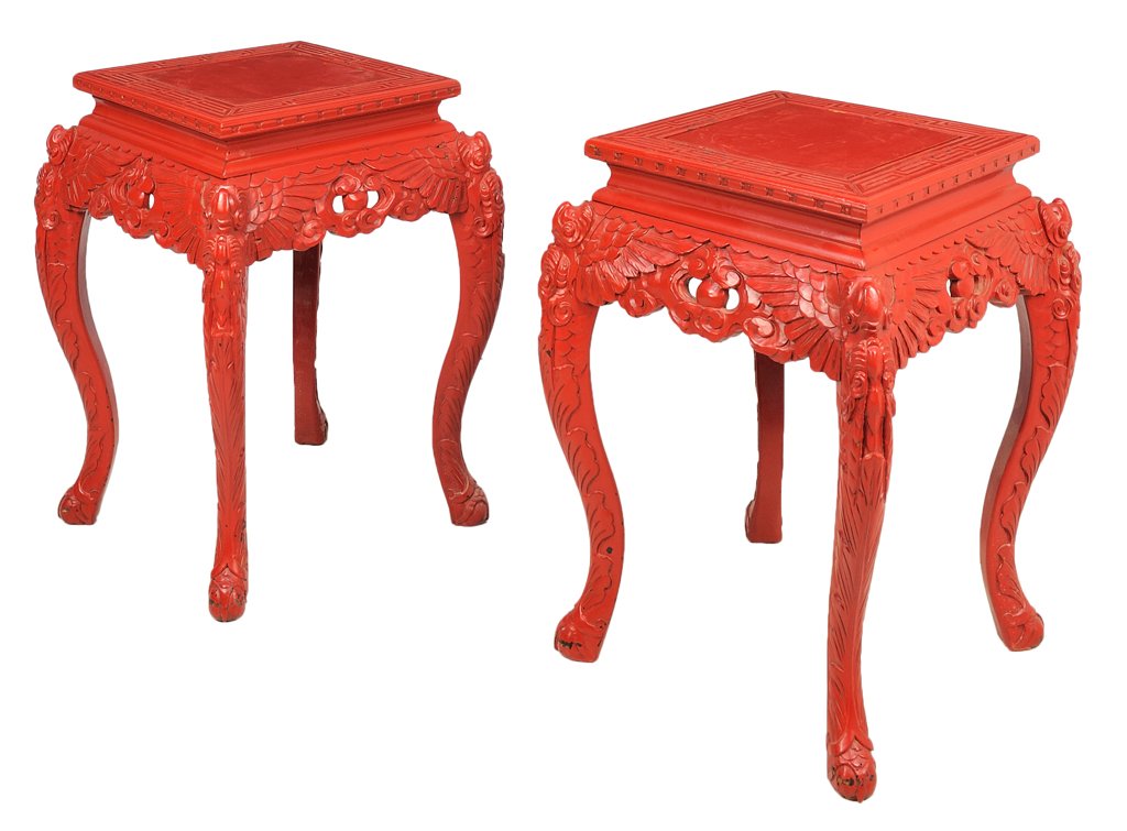 A PAIR OF CHINESE CINNABAR STYLE RED LACQUER TABLES: A PAIR OF CHINESE CINNABAR STYLE RED LACQUER TABLES Each table having a square top with geometric borders, raised on carved legs having repeating wing and scale decoration, cabriole legs ending in car