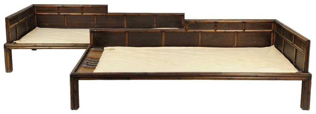 A PAIR OF CHINESE BAMBOO STYLE LUOHAN BEDS: A PAIR OF CHINESE BAMBOO STYLE LUOHAN BEDS Each bed having bamboo shoot border to back rest, over the canvas base, raised on square legs. 24 x 78½ x 33 inches.