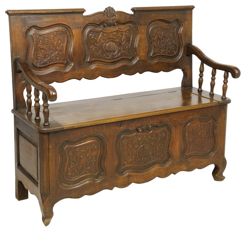 A FRENCH LOUIS XV STYLE HALL BENCH: A FRENCH LOUIS XV STYLE HALL BENCH The bench having a straight crest rail centered with a carved shell over the plank back with carved foliate decoration, above the hinged seat within open arms, the b