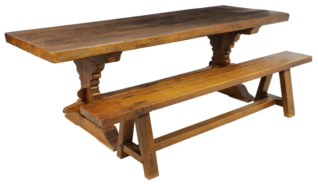 A FRENCH PROVINCIAL STYLE TRESTLE TABLE AND BENCH: A FRENCH PROVINCIAL STYLE TRESTLE TABLE AND BENCH The table having a rectangular plank top raised on twin supports, with an associated plank bench, raised on block legs joined by a single stretcher. 2