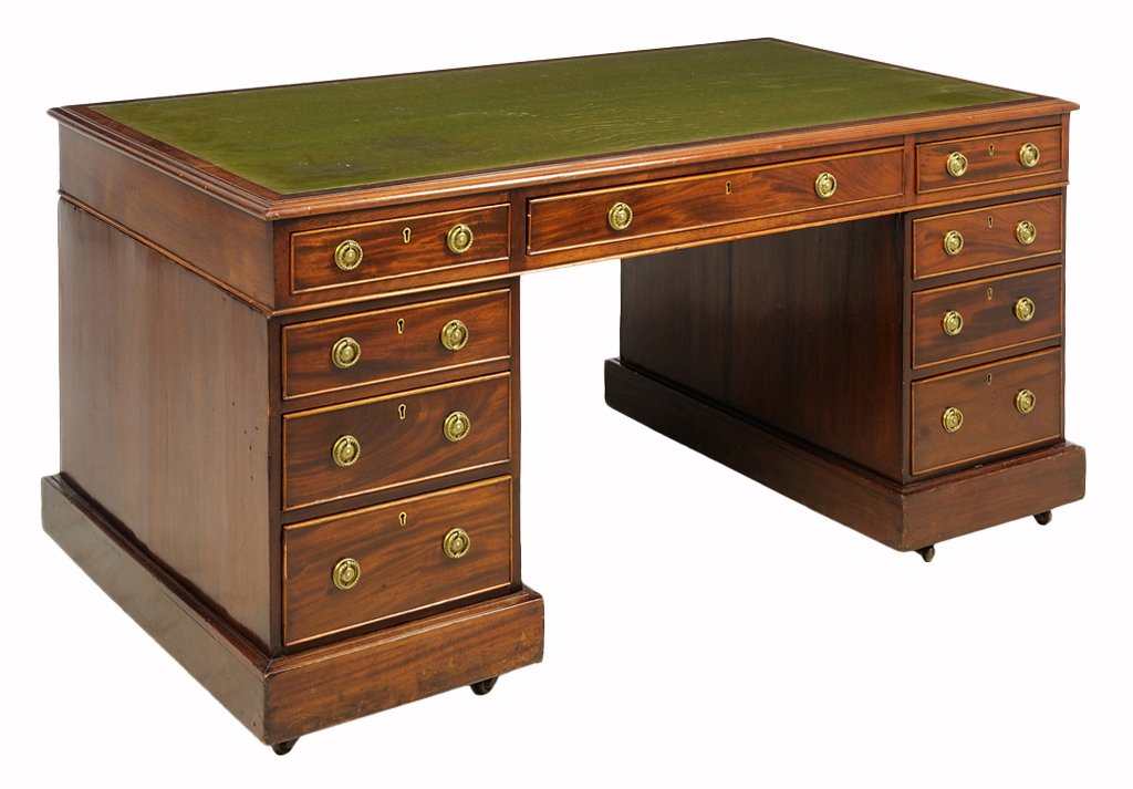 AN ENGLISH EDWARDIAN MAHOGANY PEDESTAL DESK: AN ENGLISH EDWARDIAN MAHOGANY PEDESTAL DESK Late 19th Century The desk having a leather inset writing surface over a long central drawer flanked by two columns of graduated drawers, each raised on a p