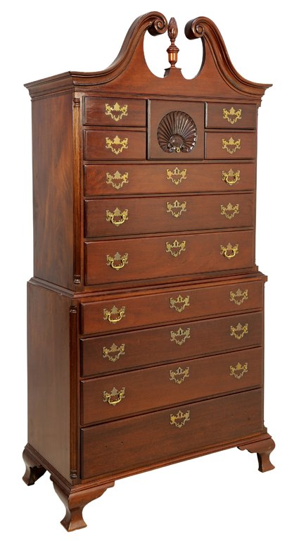 AN AMERICAN FEDERAL STYLE MAHOGANY CHEST ON CHEST: AN AMERICAN FEDERAL STYLE MAHOGANY CHEST ON CHEST The chest having a broken arch pediment centered with a flame form finial over a series of drawers centered with a carved shell, over four graduated l
