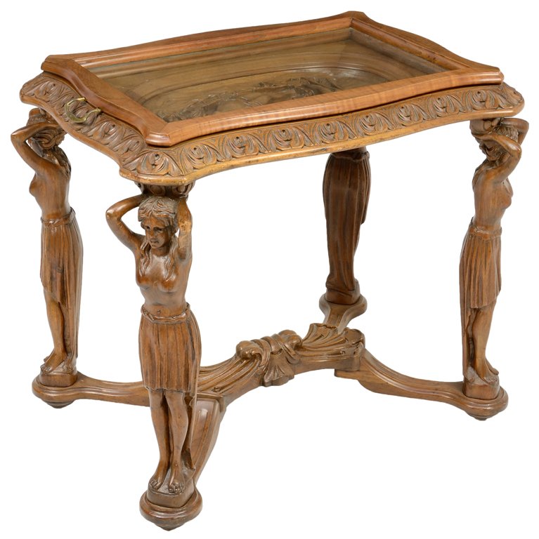 AN ITALIAN WALNUT SIDE TABLE: AN ITALIAN WALNUT SIDE TABLE The table having a rectangular top with removable glass serving tray centered with a carved relief medallion depicting the Birth of Venus, raised on caryatid form supports