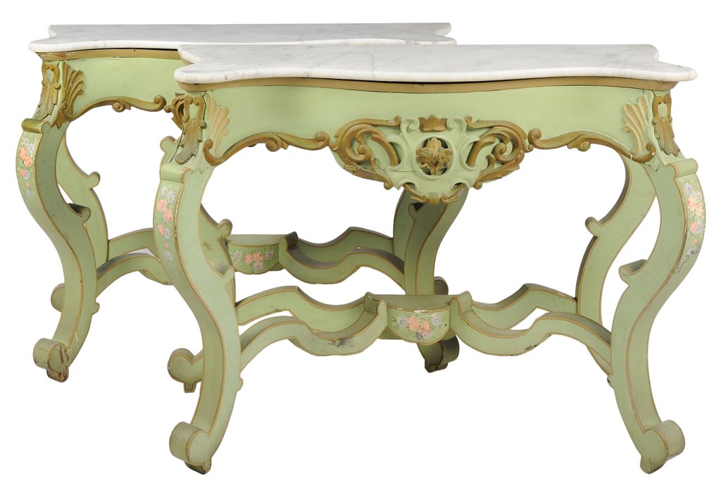 A PAIR OF ITALIAN ROCOCO STYLE PAINTED CONSOLE TABLES: A PAIR OF ITALIAN ROCOCO STYLE PAINTED CONSOLE TABLES Each table having a rectangular shaped white marble top with front cupolas, gilt painted frieze centered with carved scrolling leaves, raised on c