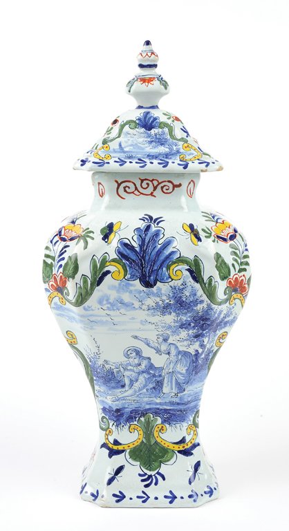 A FRENCH FAIENCE LIDDED URN: A FRENCH FAIENCE LIDDED URN 20th Century The pale blue green ground having polychrome floral and fauna decoration framing a large central reserve featuring a cobalt courting scene, marked to base. 12�