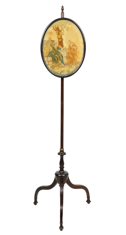 A GEORGIAN STYLE MAHOGANY POLE SCREEN: A GEORGIAN STYLE MAHOGANY POLE SCREEN The oval embroidered panel depicting a courting couple, raised on a cylindrical standard ending in a tripod base. 52¼ x 16½ x 16½ inches.