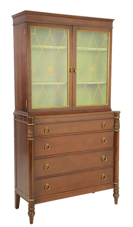 AN EMPIRE STYLE MAHOGANY SECRETARY BOOKCASE: AN EMPIRE STYLE MAHOGANY SECRETARY BOOKCASE 20th Century The bookcase having a flared cornice over two astragal painted glazed doors over the conforming case fitted with four long drawers set with gil