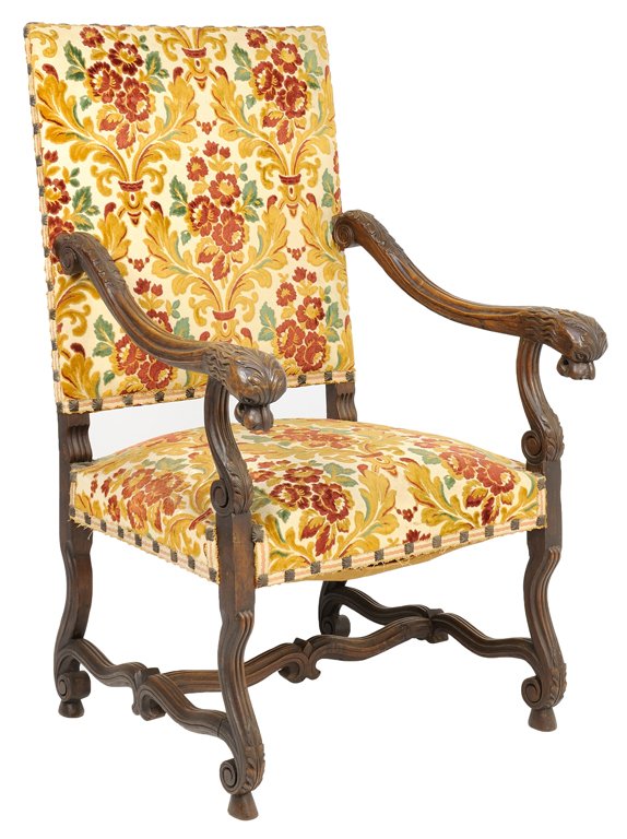A RENAISSANCE REVIVAL UPHOLSTERED HALL CHAIR: A RENAISSANCE REVIVAL UPHOLSTERED HALL CHAIR The hall chair having a straight crest rail over the upholstered back and seat with nailhead border, within curved arms having griffin head rests, raised o