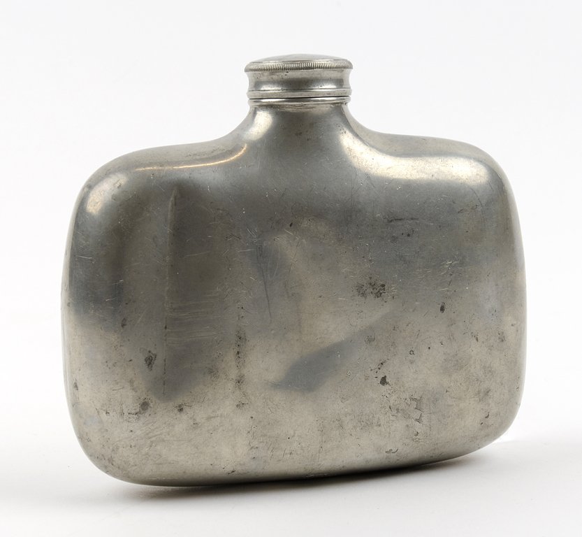 A JAMES DIXON & SONS PEWTER ALLOY HIP FLASK: A JAMES DIXON & SONS PEWTER ALLOY HIP FLASK Circa Late 19th - Early 20th Century The Britannia metal flask of slightly curved rectangular form, with screw-top closure, marks at base for James Dixon &