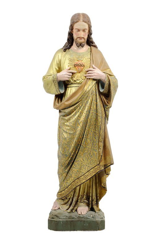 A PAINTED PLASTER SACRED HEART RELIGIOUS FIGURE: A PAINTED PLASTER SACRED HEART RELIGIOUS FIGURE The painted plaster figure depicting a robed Christ of the Sacred Heart, raised on an integral base. H 47 x W 17 x D 10 inches.