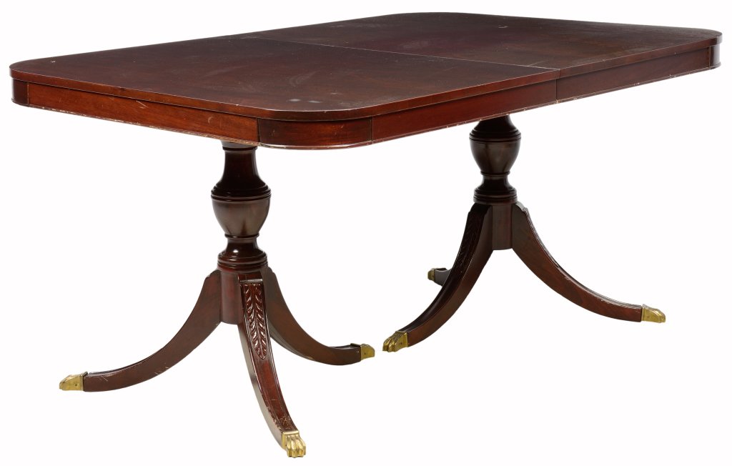 A DUNCAN PHYFE STYLE MAHOGANY EXTENSION DINING TABLE: A DUNCAN PHYFE STYLE MAHOGANY EXTENSION DINING TABLE The dining table having a rectangular top with rounded corners, raised on twin supports each with a baluster standard, raised on splayed tripartite