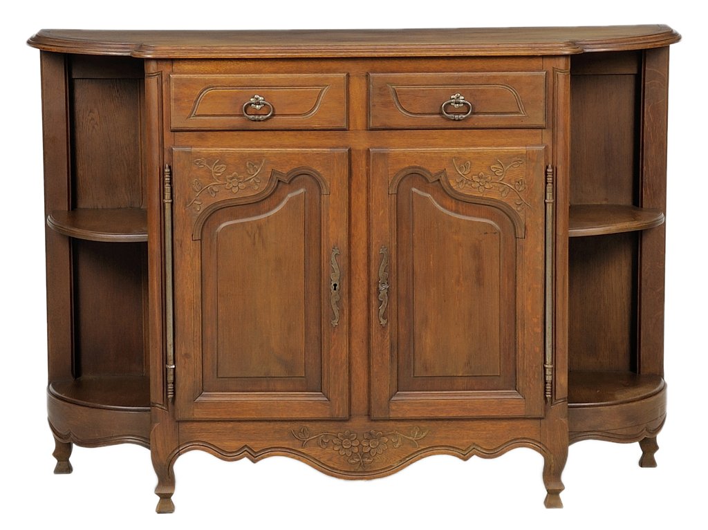 A FRENCH PROVINCIAL STYLE SIDEBOARD: A FRENCH PROVINCIAL STYLE SIDEBOARD The sideboard having a rectangular stepback top over two short drawers and two paneled doors flanked by corner shelves, above a serpentine apron ending in shaped fe
