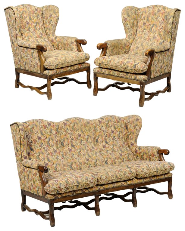 A FRENCH LOUIS XIV STYLE UPHOLSTERED PARLOR SUITE: A FRENCH LOUIS XIV STYLE UPHOLSTERED PARLOR SUITE The suite comprising a settee and two wingback armchairs. Each having a domed crest rail over the upholstered, back arms and seat with nailhead trim r