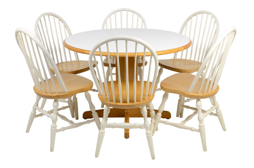 AN AMERICAN WINDSOR STYLE BREAKFAST SET: AN AMERICAN WINDSOR STYLE BREAKFAST SET The breakfast set comprising a table having a circular top, raised on a quadripartite base. Together with six side chairs having a curved crest rail over the ve