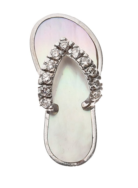 A 14 KARAT WHITE GOLD, DIAMOND, AND MOTHER-OF-PEARL: A 14 KARAT WHITE GOLD, DIAMOND, AND MOTHER-OF-PEARL CHARM The 14K white gold charm in the form of a sandal with mother-of-pearl footbed, the strap set with 11 brilliant-cut diamonds of SI2-I2 clarity 