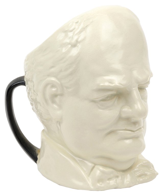 A ROYAL DOULTON CHURCHILL LOVING CUP, MODELED BY: A ROYAL DOULTON CHURCHILL LOVING CUP, MODELED BY CHARLES NOKE English, Circa 1940 Executed in white glaze with two black handles, the base inscribed Winston Spencer Churchill, Prime Minister of Britai