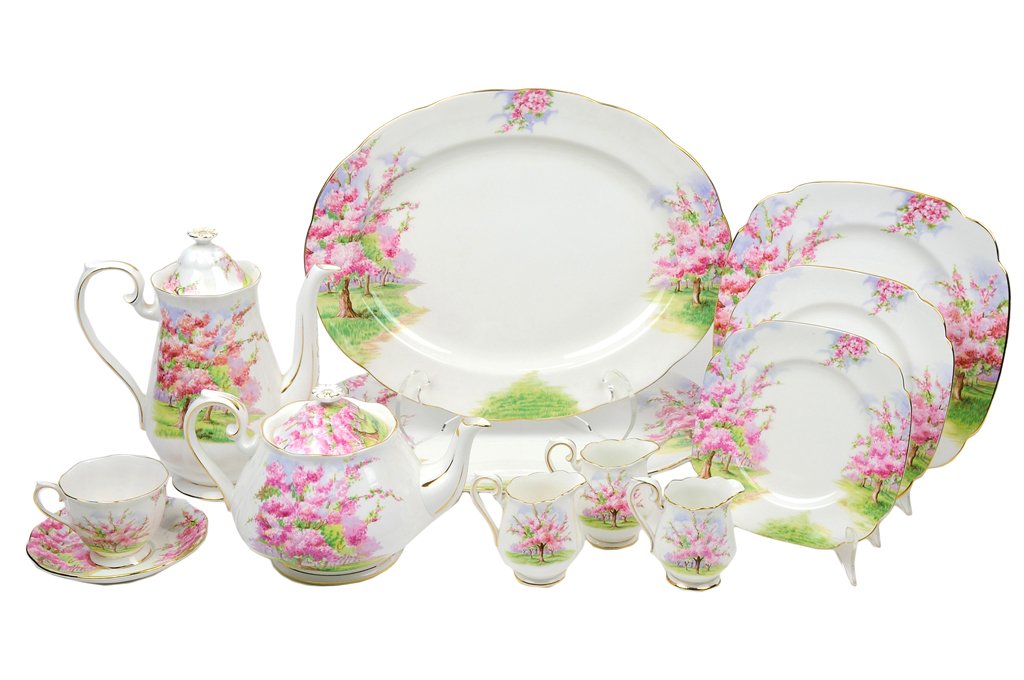 A ROYAL ALBERT PORCELAIN PARTIAL DINNER SERVICE 40: A ROYAL ALBERT PORCELAIN PARTIAL DINNER SERVICE In the Blossom Time pattern. The service comprising two serving platters, 4 dinner plates, 6 luncheon plates, 4 dessert plates, 2 bread plates, 9 teacup