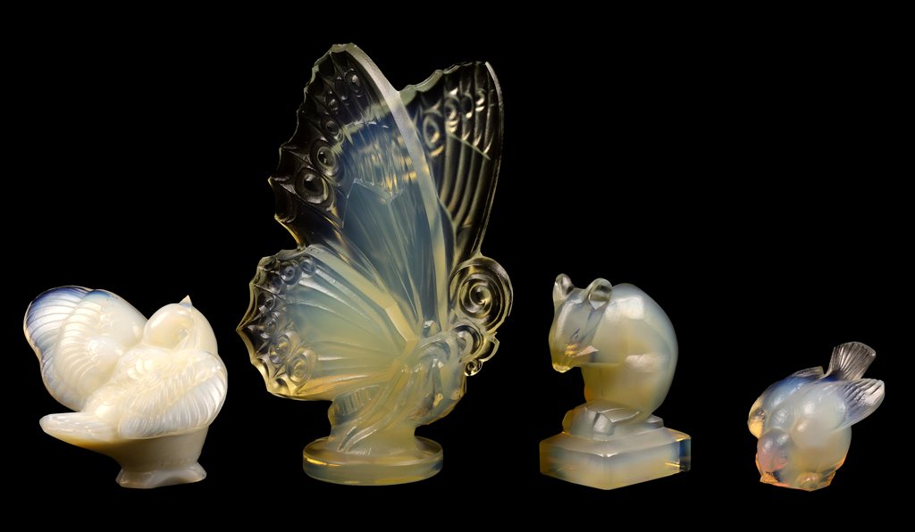 A GROUP OF FOUR SABINO OPALESCENT GLASS ANIMAL FIGURES: A GROUP OF FOUR SABINO OPALESCENT GLASS ANIMAL FIGURES Comprising a butterfly, two bird figures of differing size and form, and a mouse. H 6 x W 2 x D 4¾ inches. Provenance: Property from a Private H