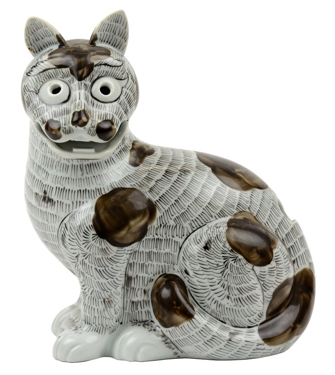 A MOTTAHEDEH CHINESE EXPORT STYLE PORCELAIN FIGURE: A MOTTAHEDEH CHINESE EXPORT STYLE PORCELAIN FIGURE The Mottahedeh porcelain figure modeled after a rare Chinese Kangxi period export bisque porcelain night lamp in the form of a cat, the base marked T