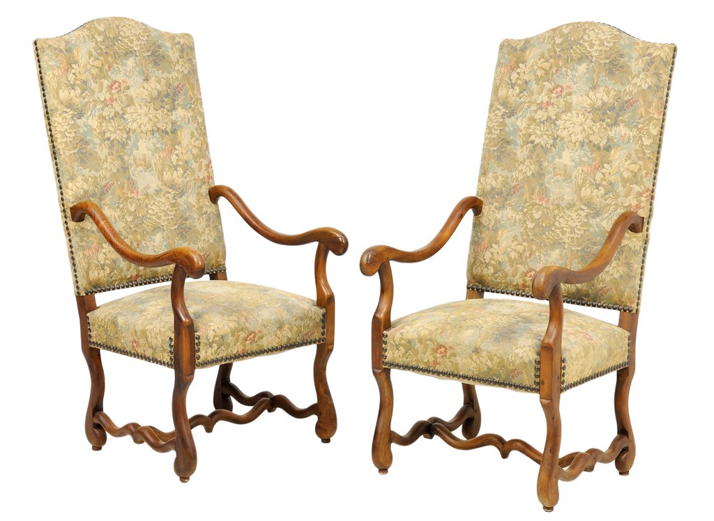 A PAIR OF FRENCH LOUIS XIV STYLE HALL CHAIRS: A PAIR OF FRENCH LOUIS XIV STYLE HALL CHAIRS Each chair having a domed crest rail over the upholstered back and seat, with nailhead border, within scrolled arms, raised on shaped legs, joined by H-for