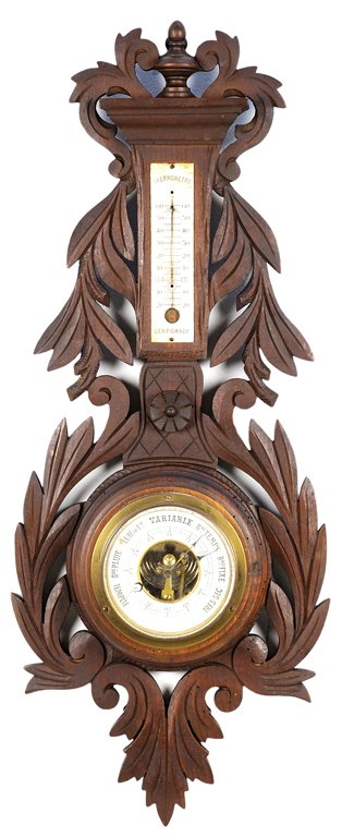 A BLACK FOREST STYLE BAROMETER: A BLACK FOREST STYLE BAROMETER Having a thermometer mount, lacking glass, at upper center above the barometer at lower center and with carved foliate decoration throughout. H 9¼ x W 23½ x D 2½ inch